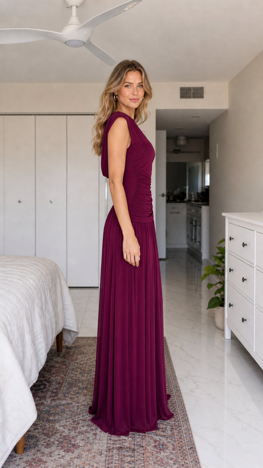 Side profile view of burgundy evening dress