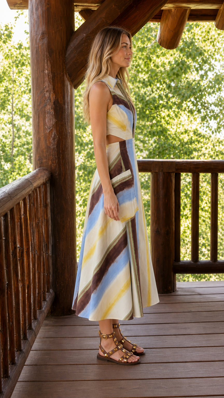 Side profile of cream striped sleeveless midi dress