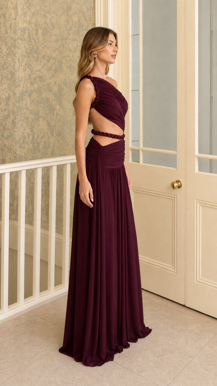 Side profile view of burgundy evening dress