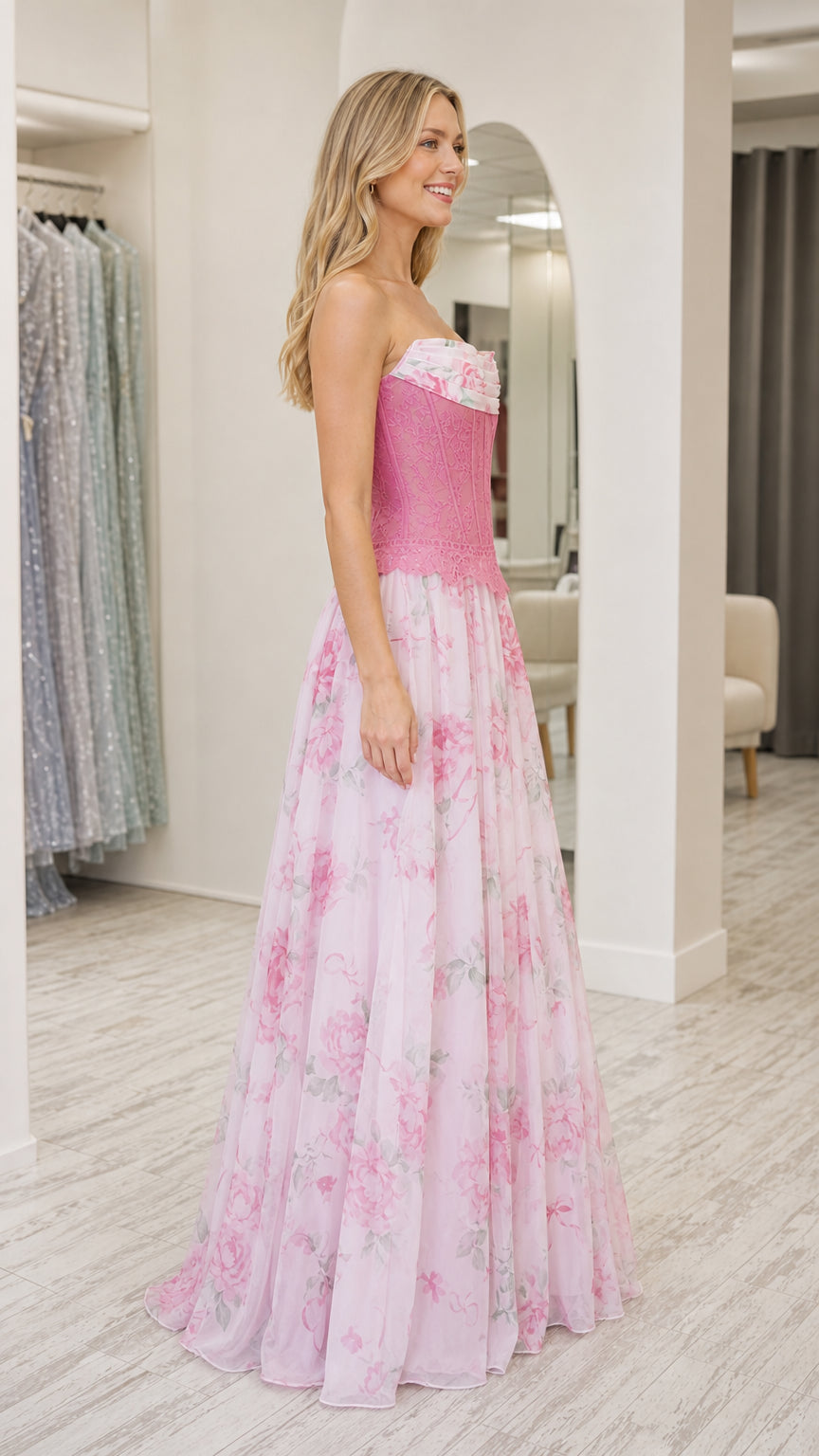 Model wearing pink strapless floral corset long dress side view