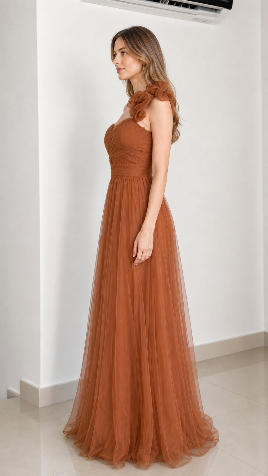 Side profile of rust brown tulle gown