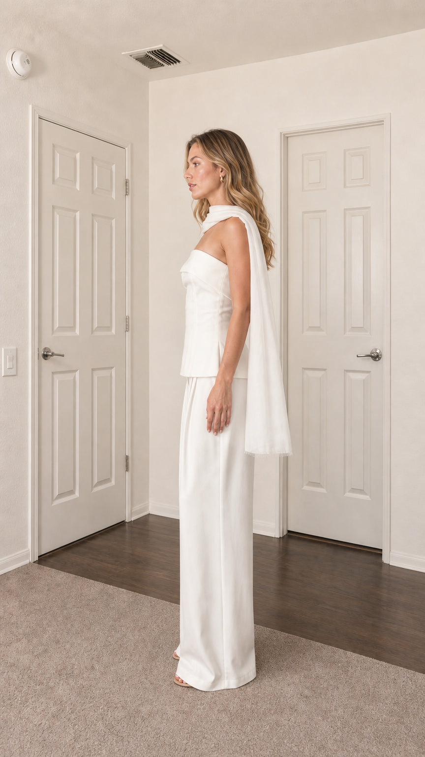 Side profile view of model in white two-piece set