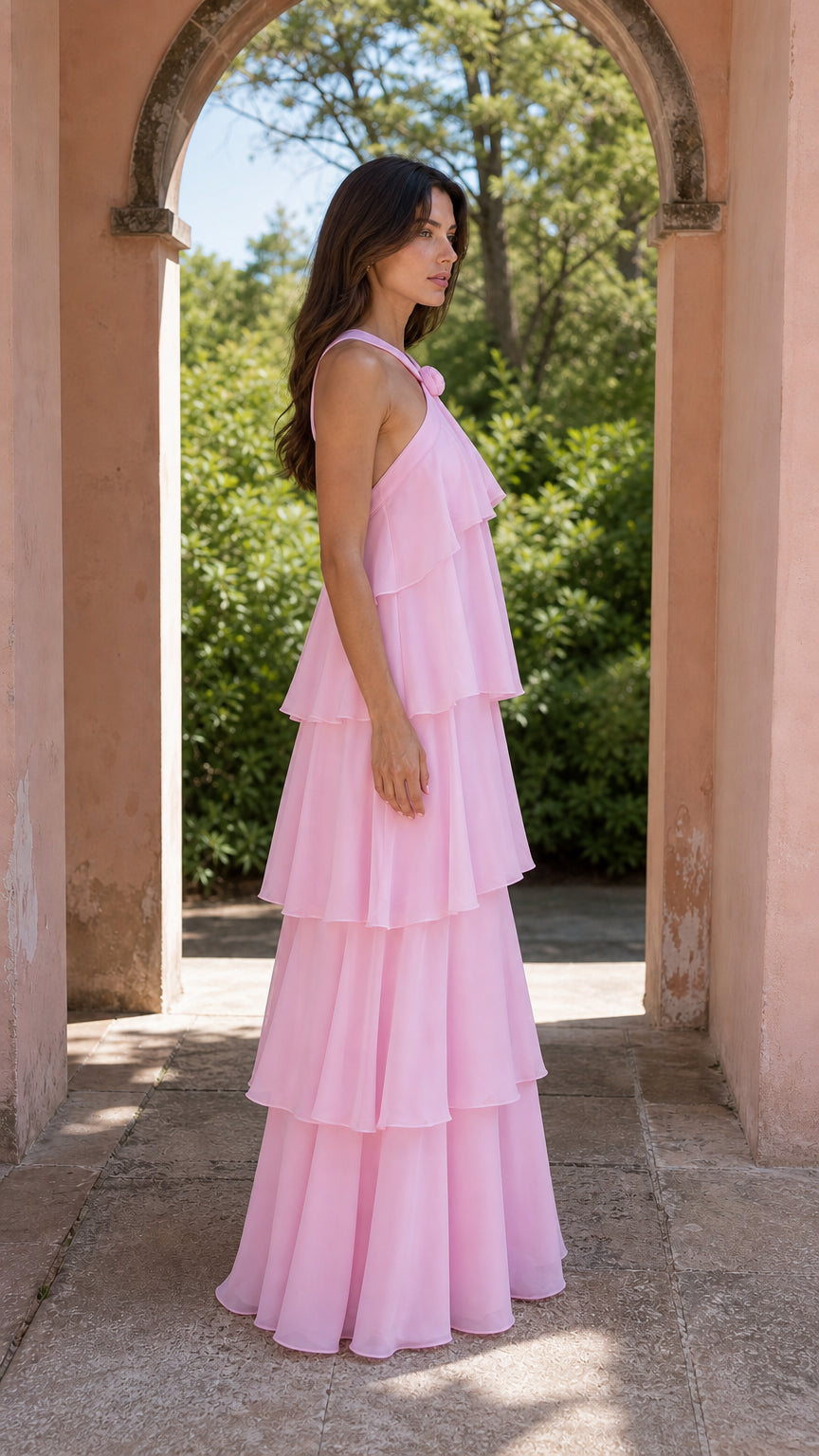 Side profile of model wearing pink maxi dress outdoors