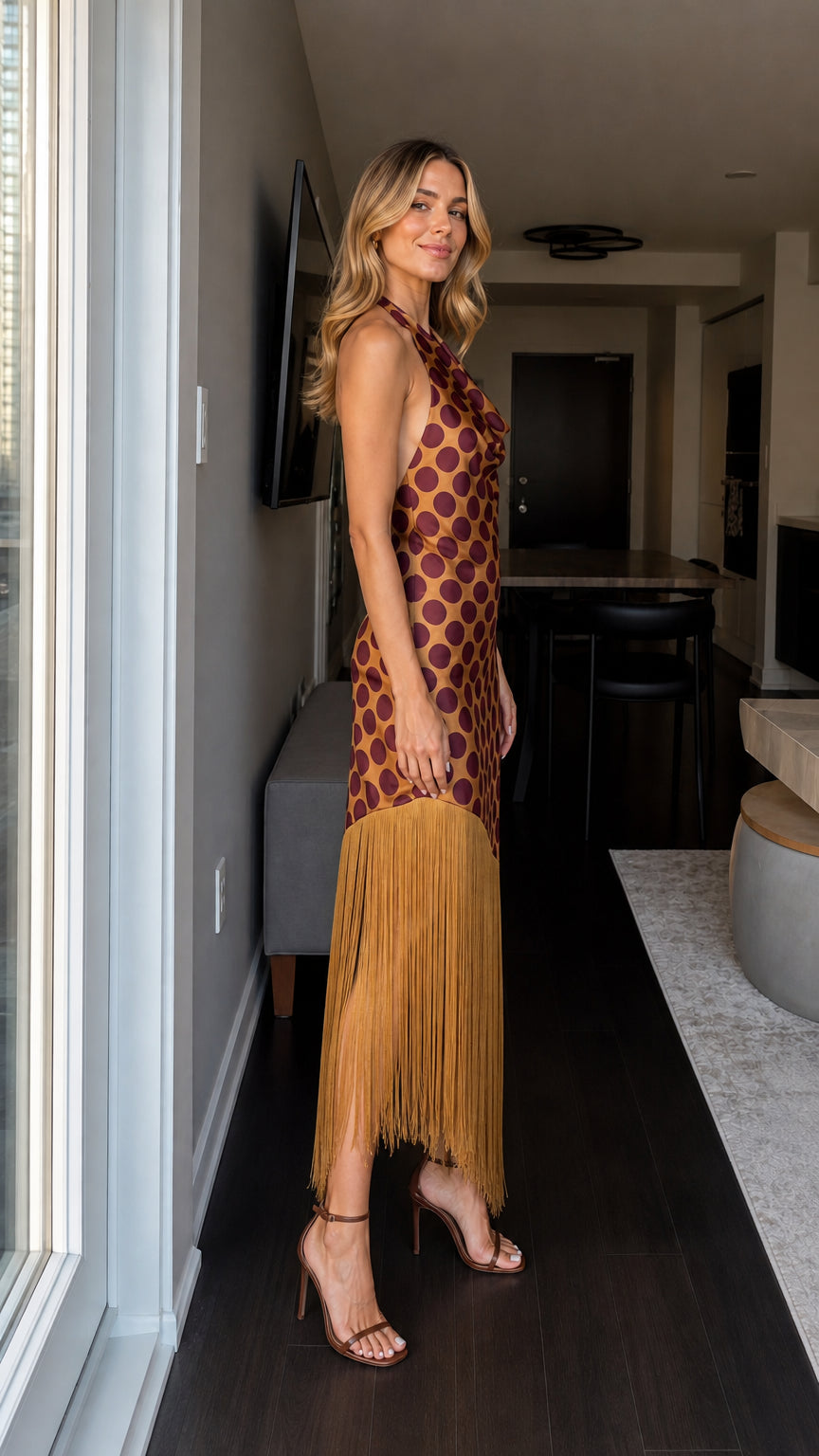 Side profile view of woman in brown polka dot dress