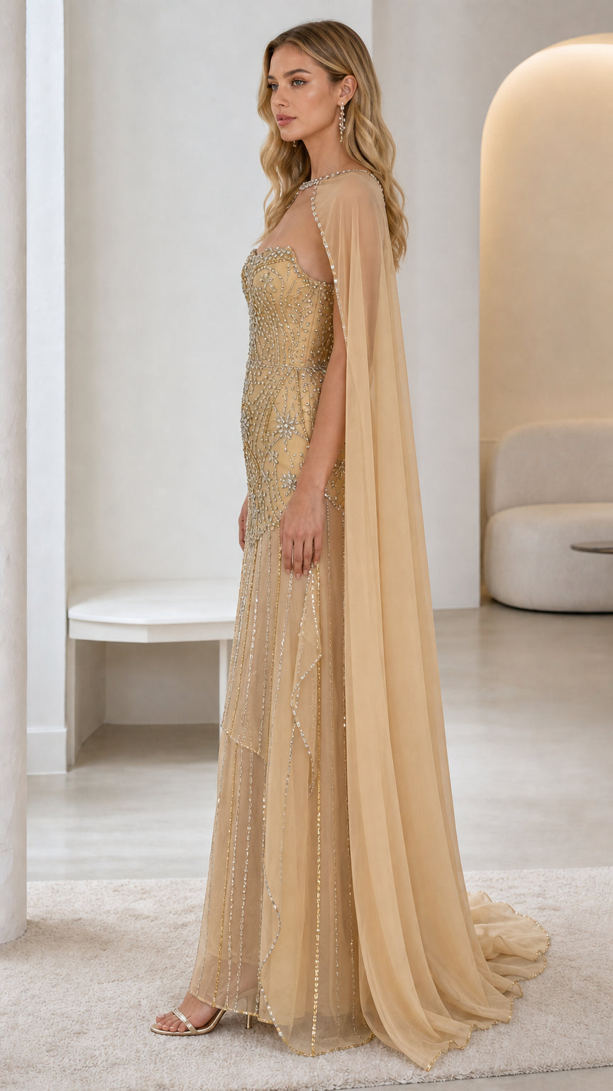 Side profile of gold evening gown showing cape length