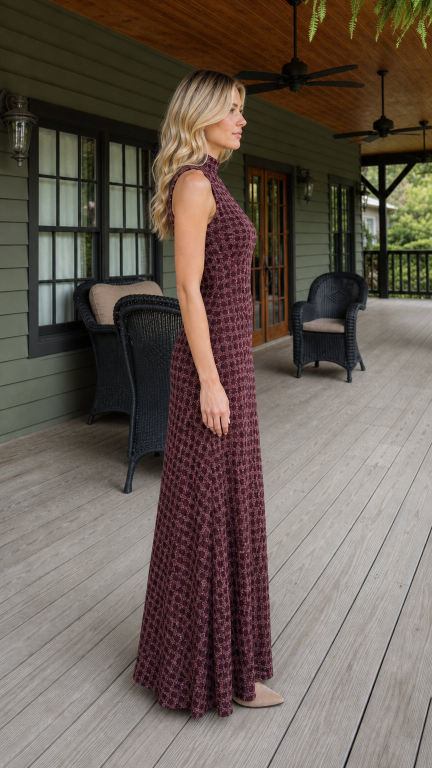 Side profile view of woman wearing burgundy maxi dress