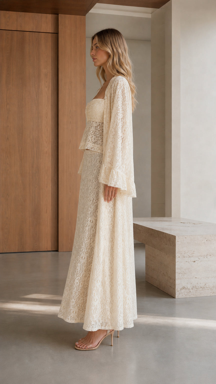 Side profile view of cream lace three-piece apparel set