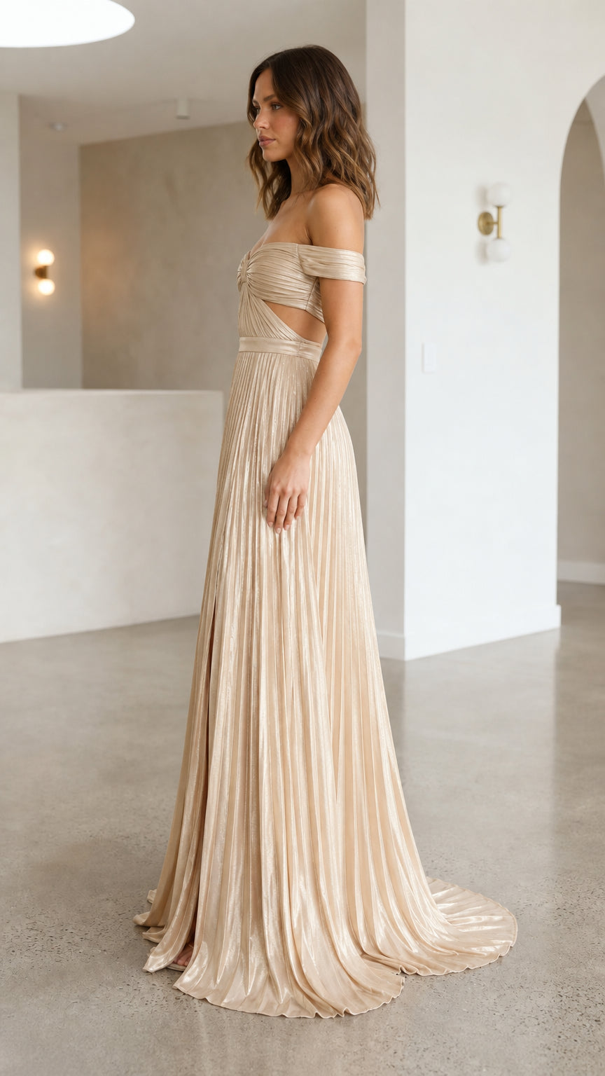 Side view of champagne evening gown with cutouts