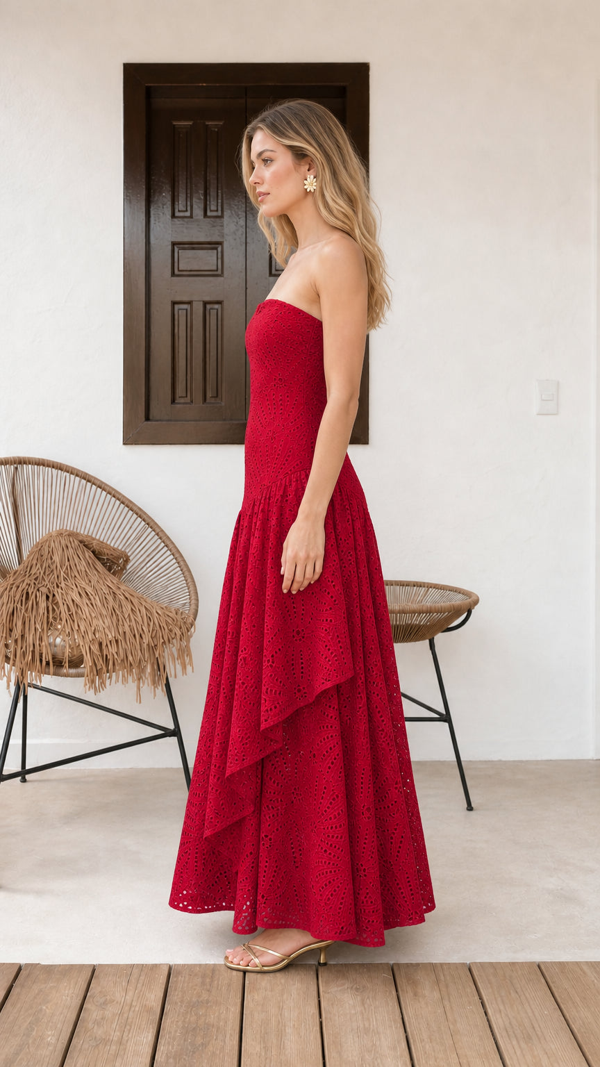 Model wearing red strapless eyelet maxi dress side view