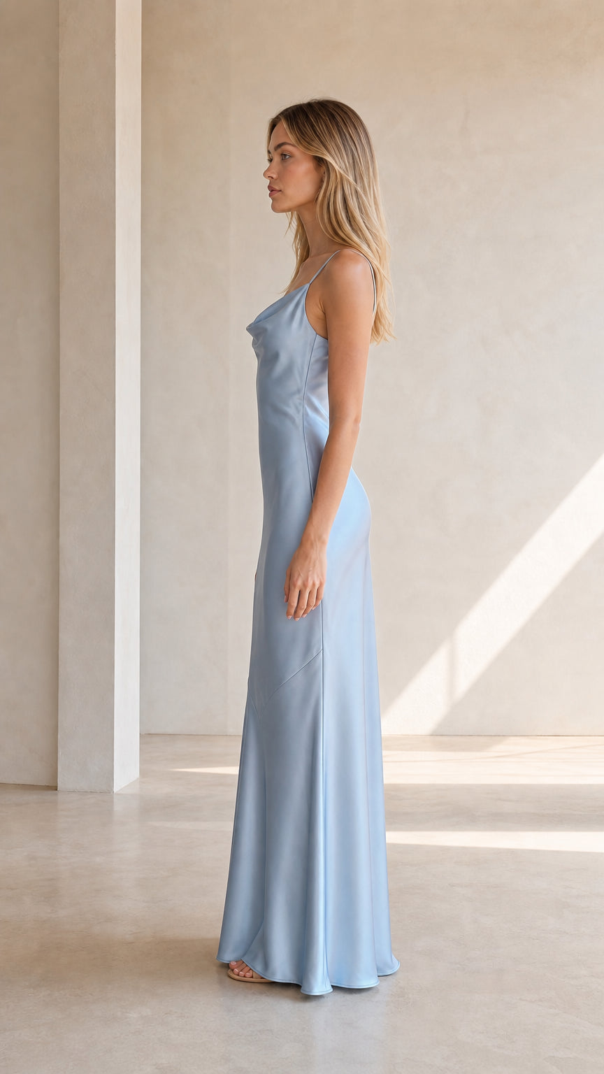 Side view of model in light blue satin dress