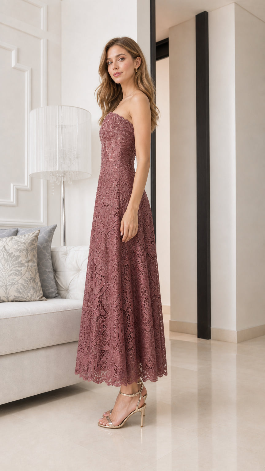 Side profile of model wearing mauve strapless lace midi dress