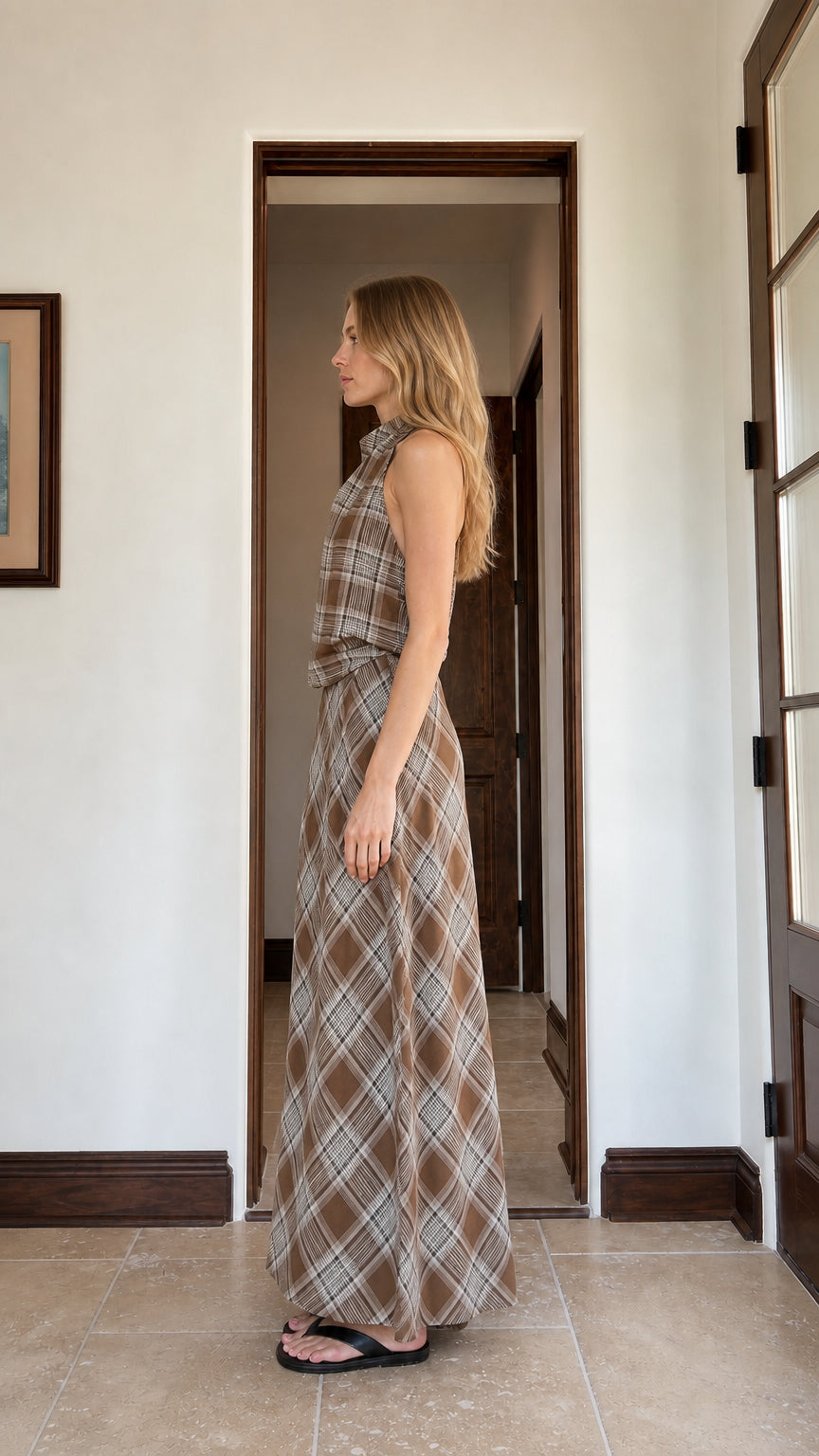 Side profile of woman in brown plaid matching set