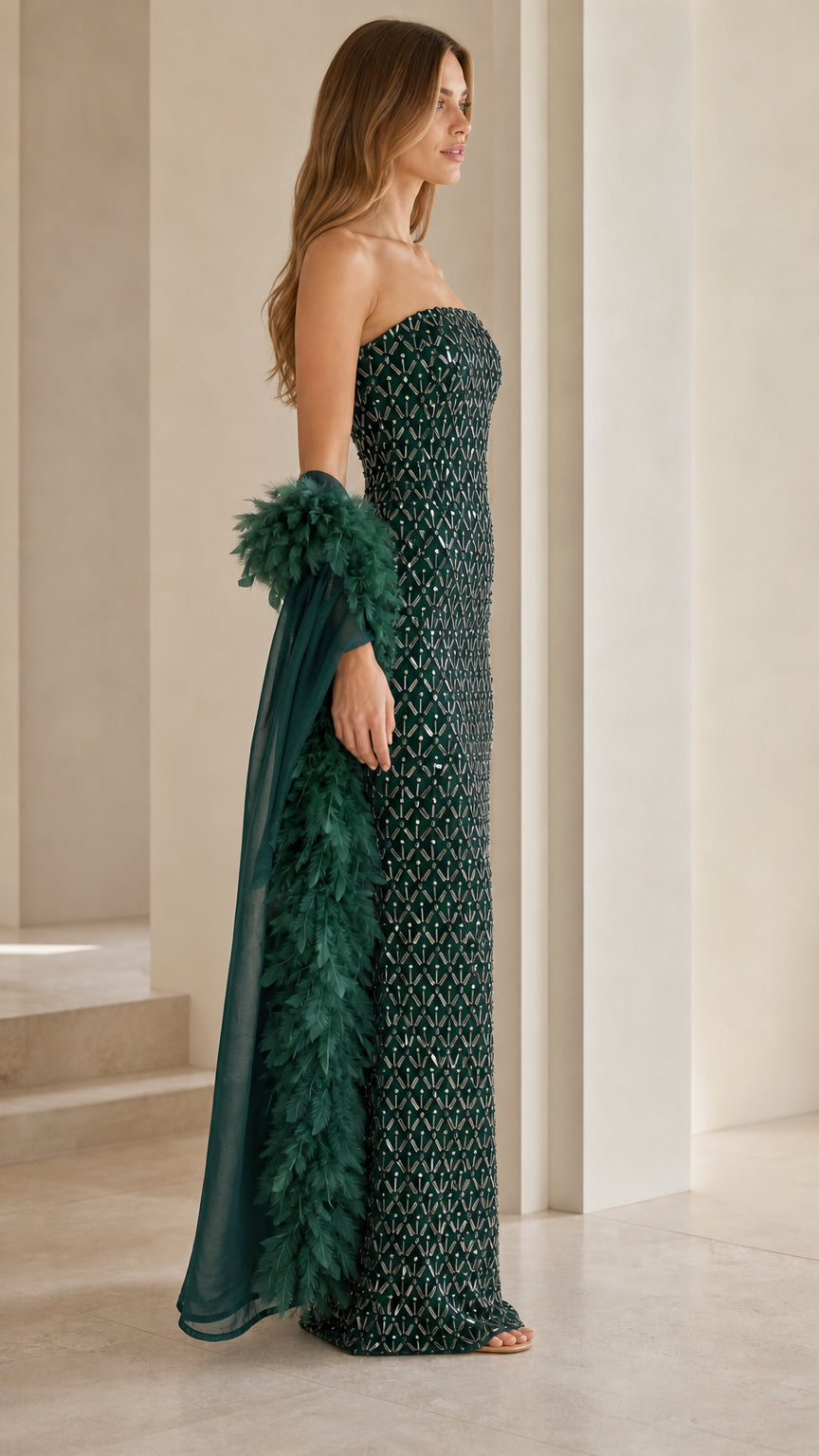 Side profile view of emerald green sequin gown