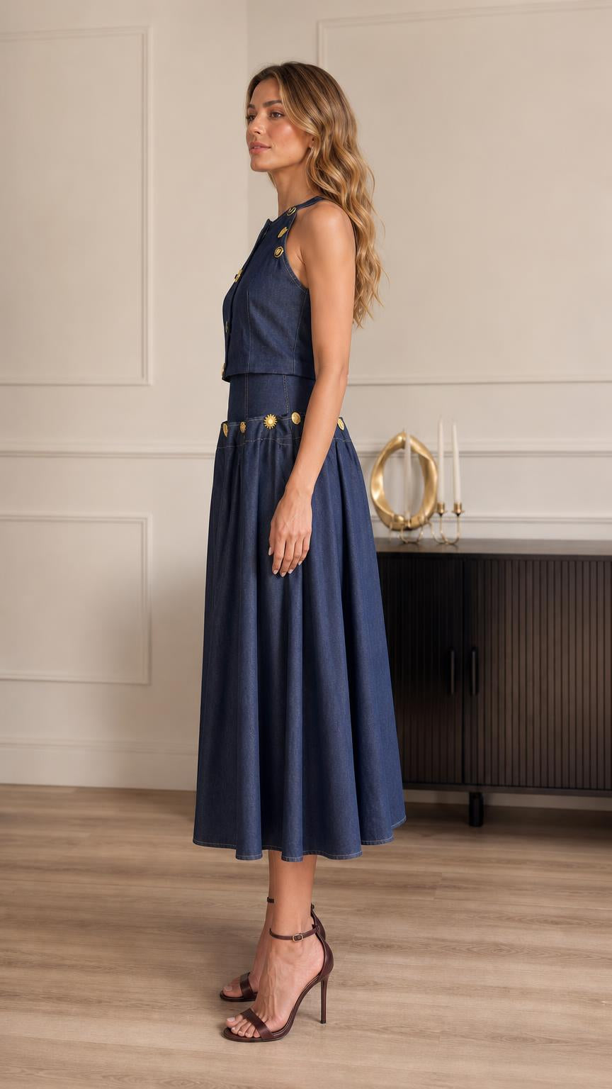 Side profile of model in blue denim two-piece outfit