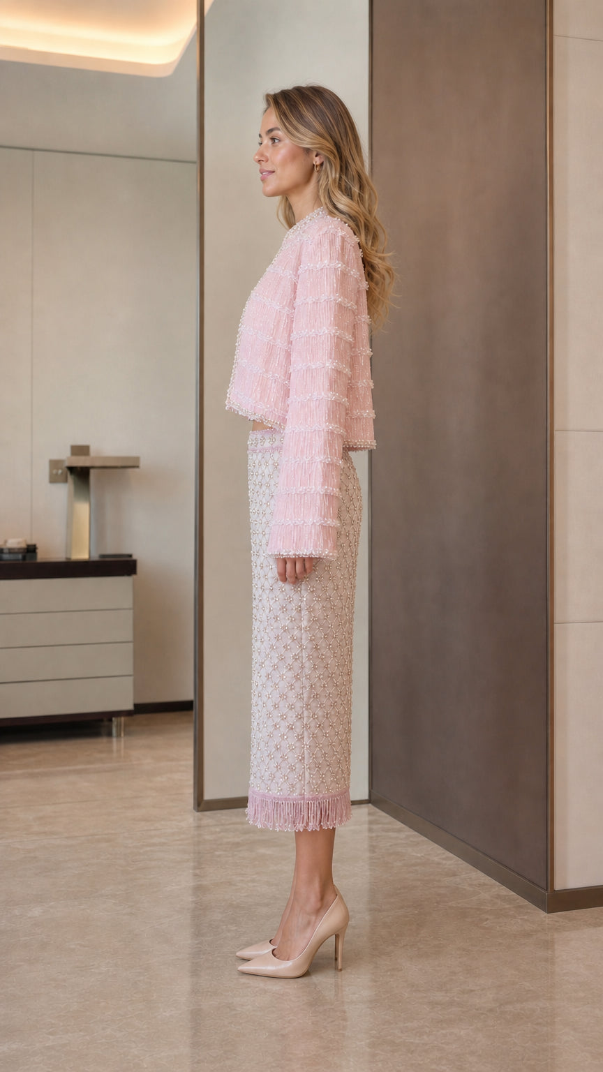 Model wearing pink tweed set side view