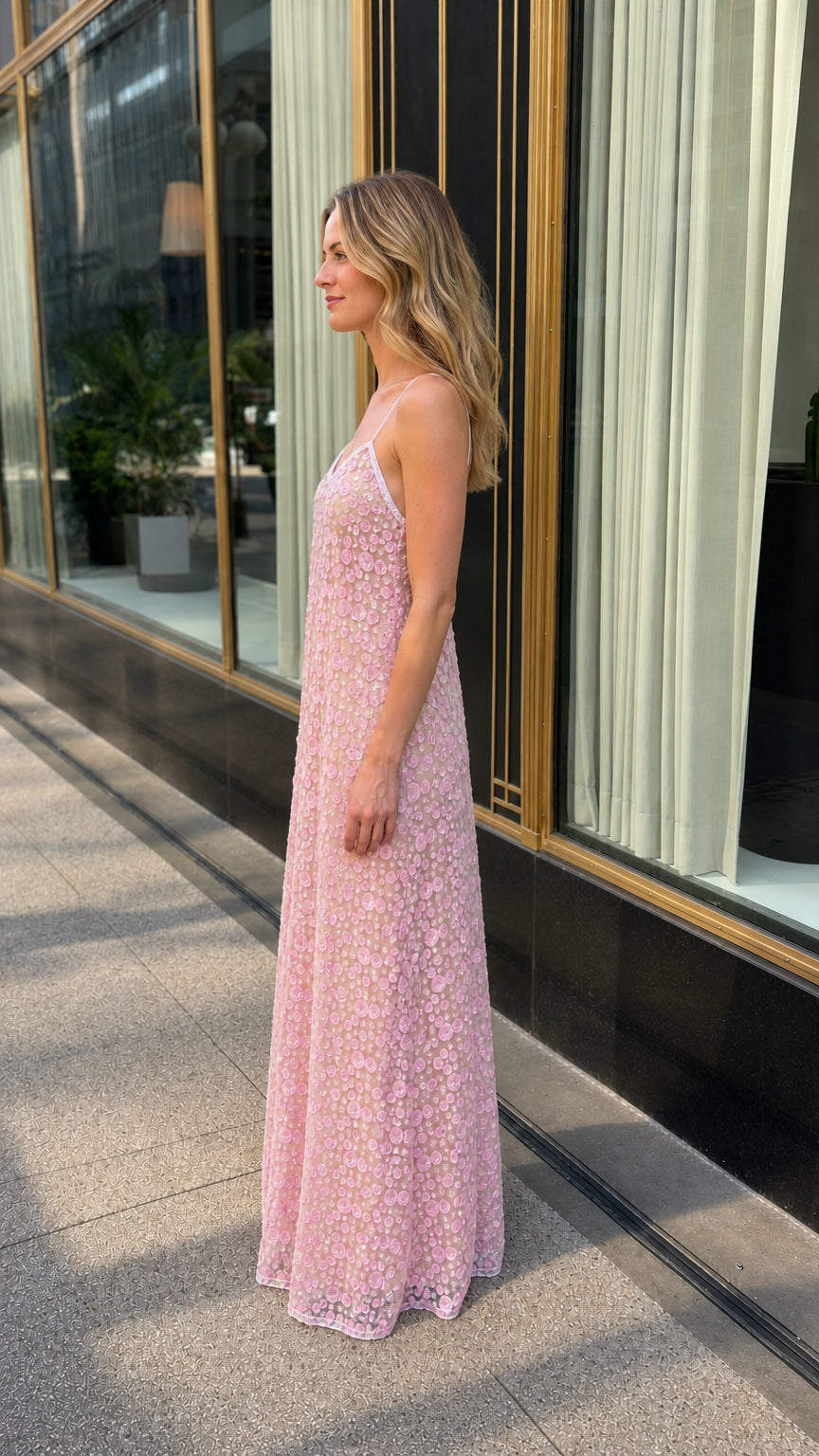 Side profile view of pink maxi dress