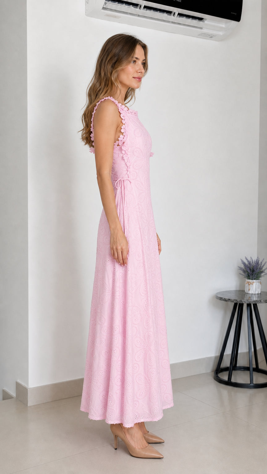 Side profile of model wearing pink eyelet maxi dress