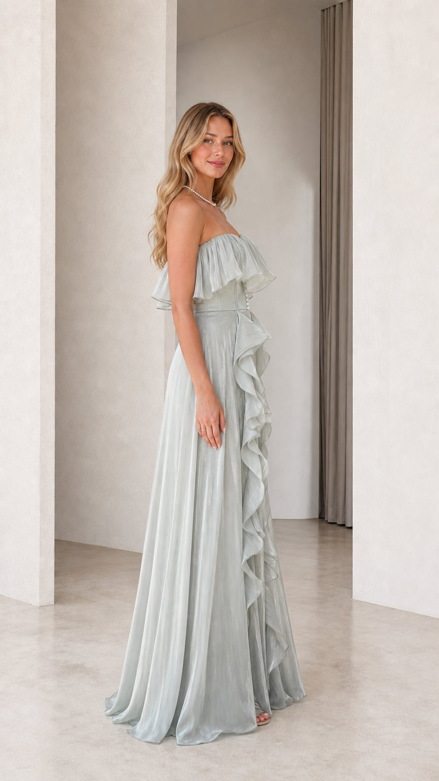 Side profile of sage green evening gown with cascading ruffles
