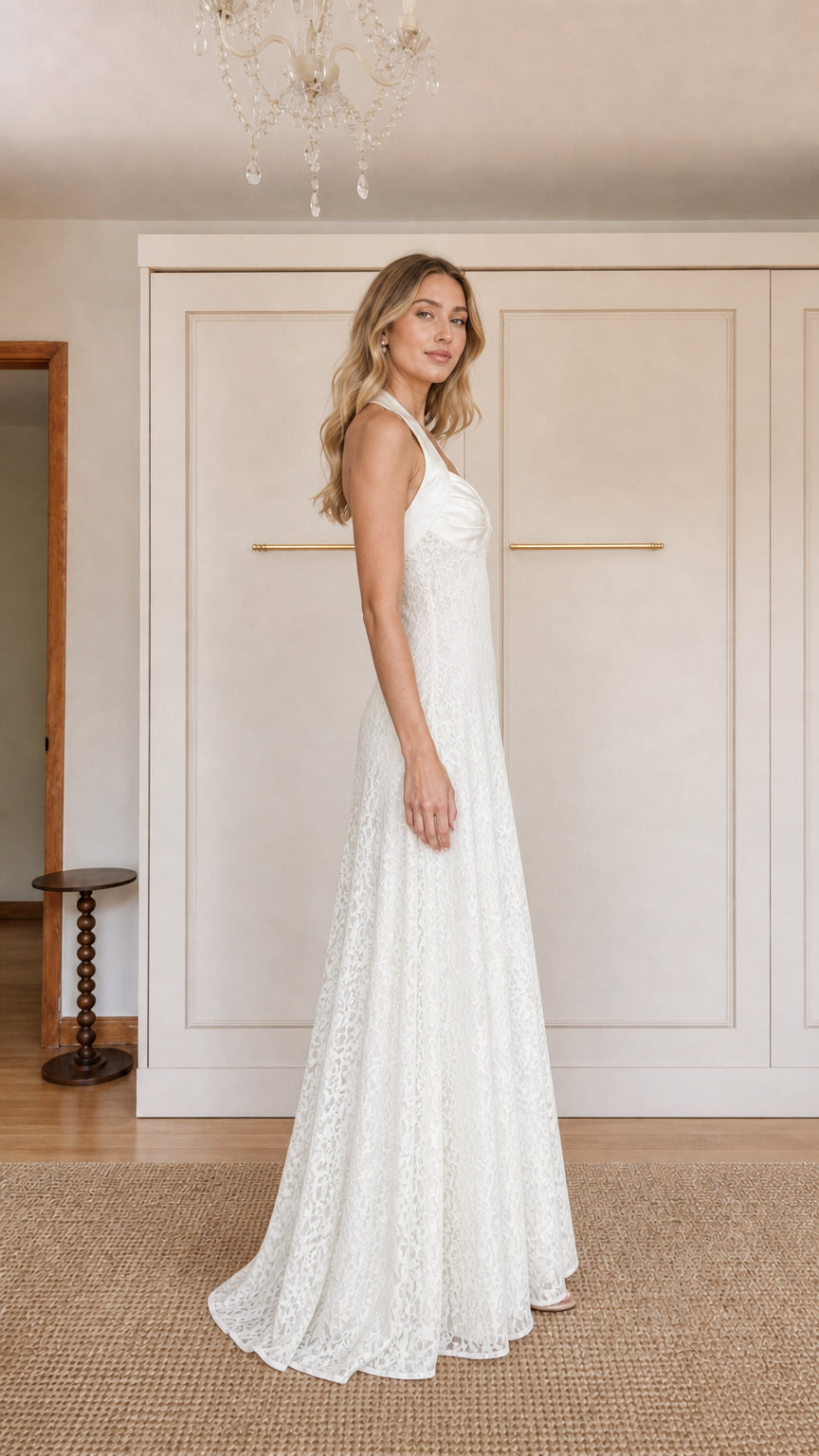 Side profile of model in White lace evening gown