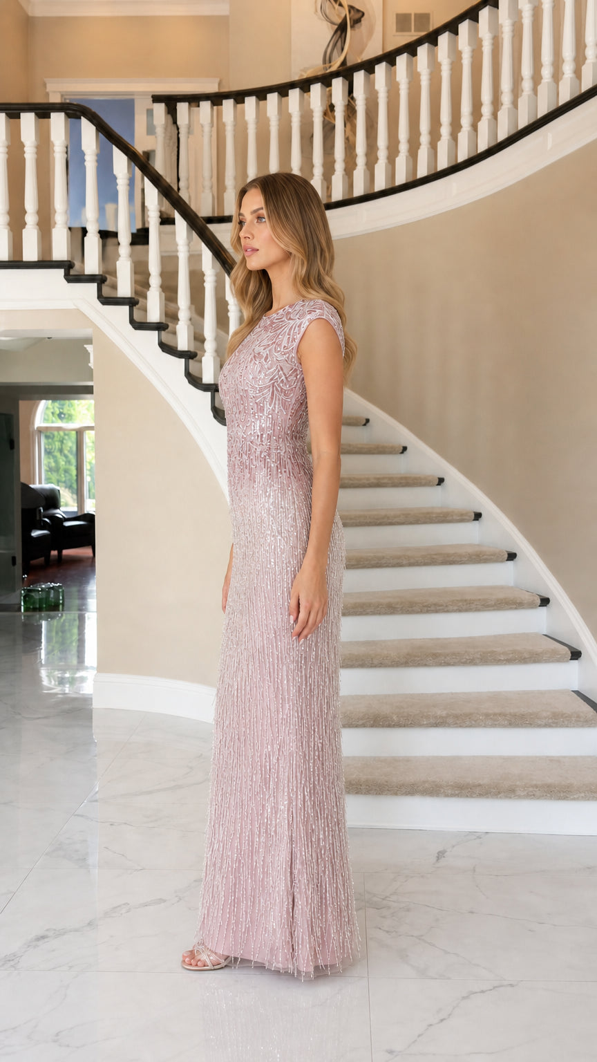 Side profile of model in dusty rose floor-length gown