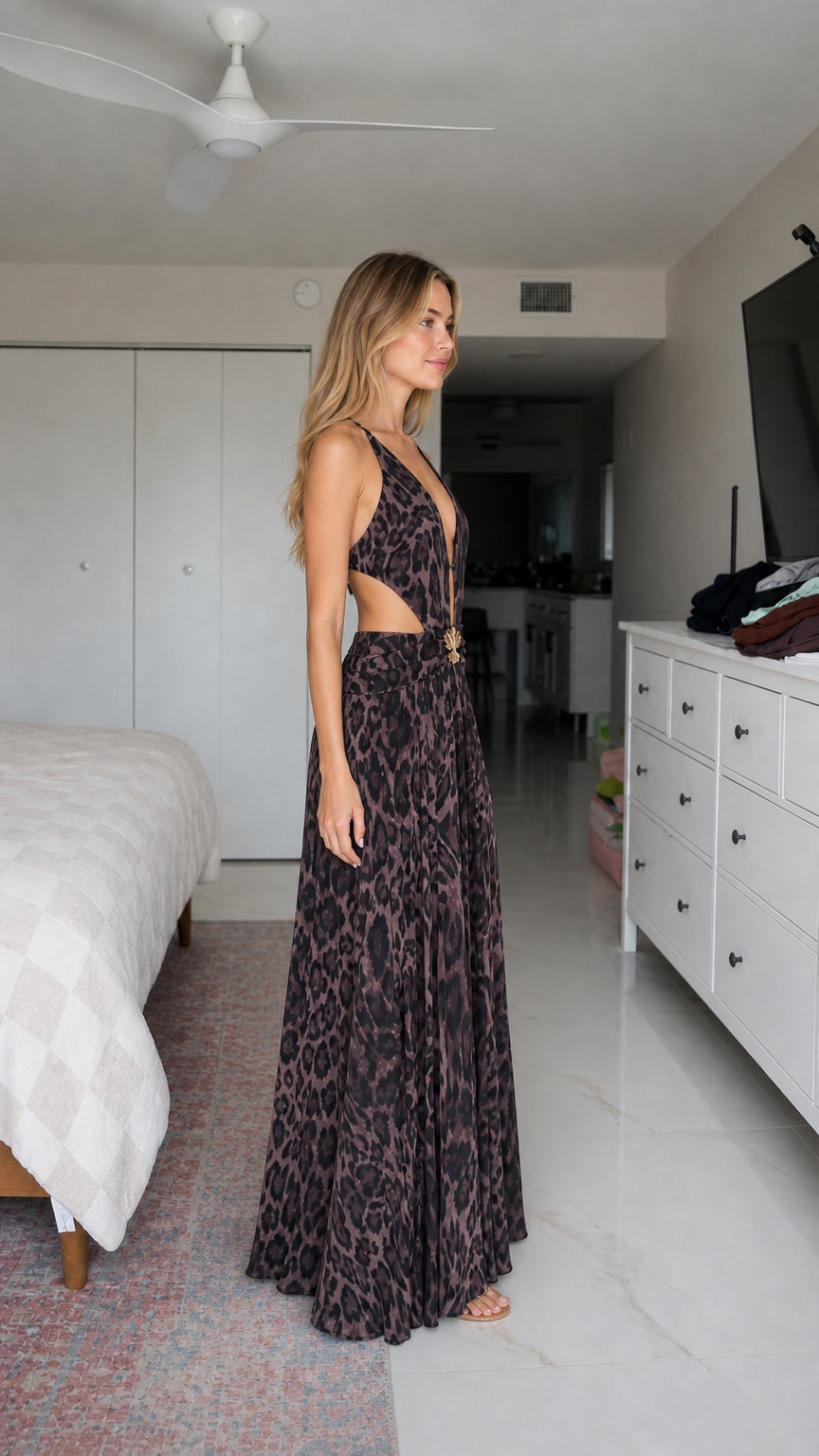 Side profile view of model in mauve animal print maxi dress