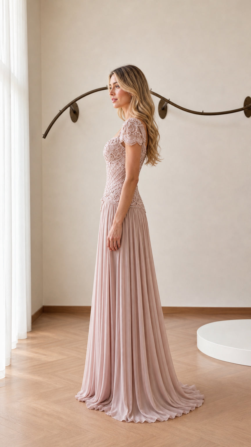 Side profile view of blush pink evening gown