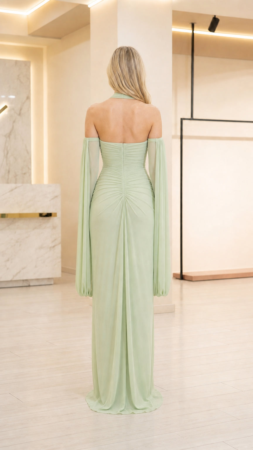 Back view showing open back design of sage green dress