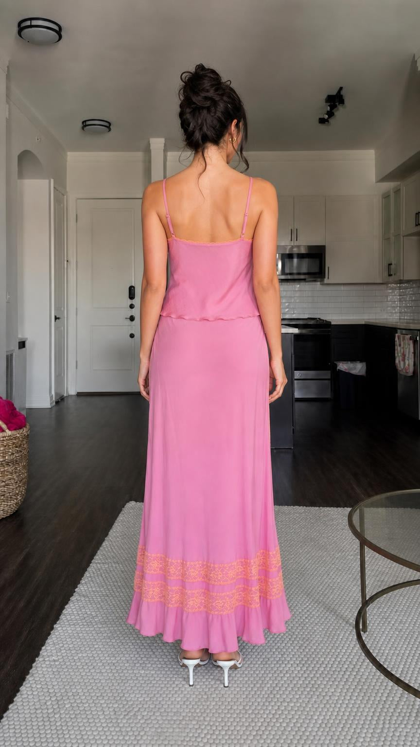 Back view of model wearing pink satin set