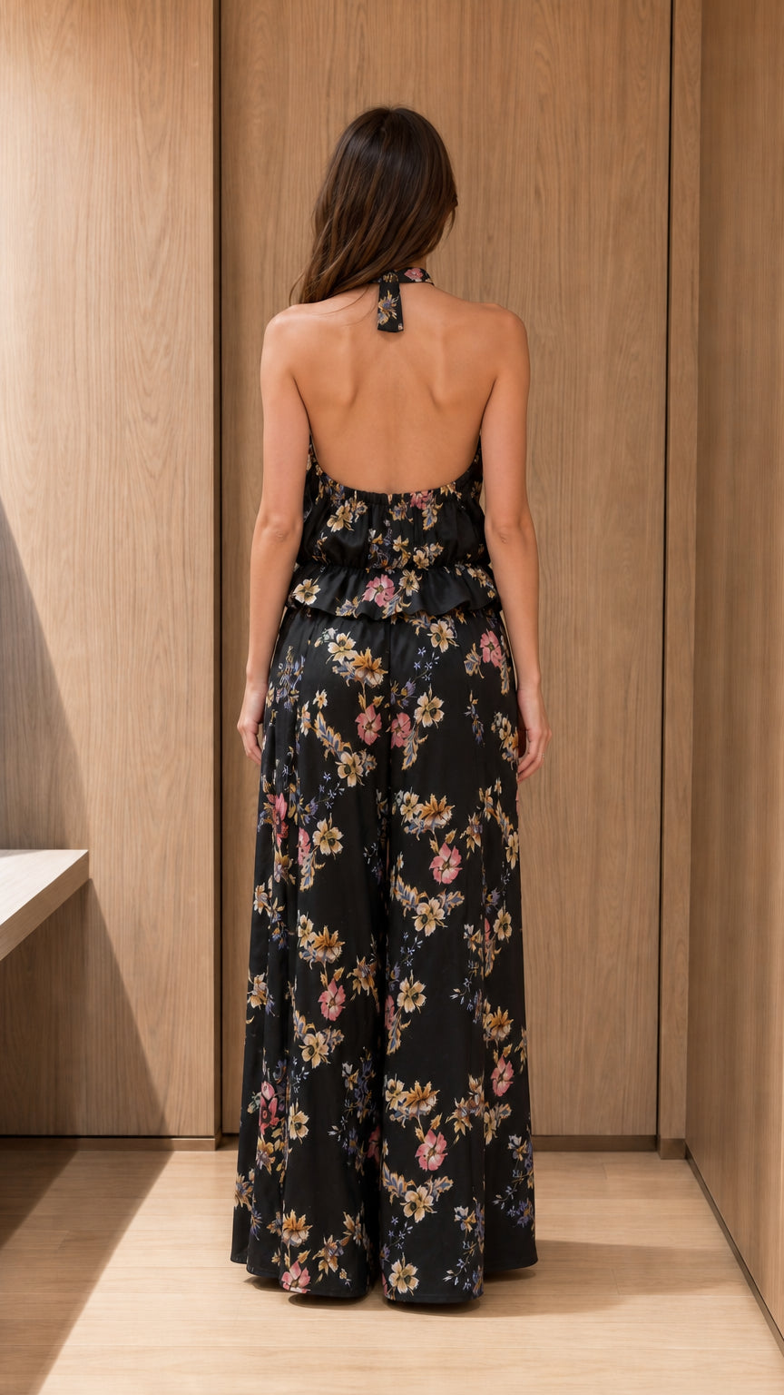 Back view of black floral halter top and wide-leg pants set