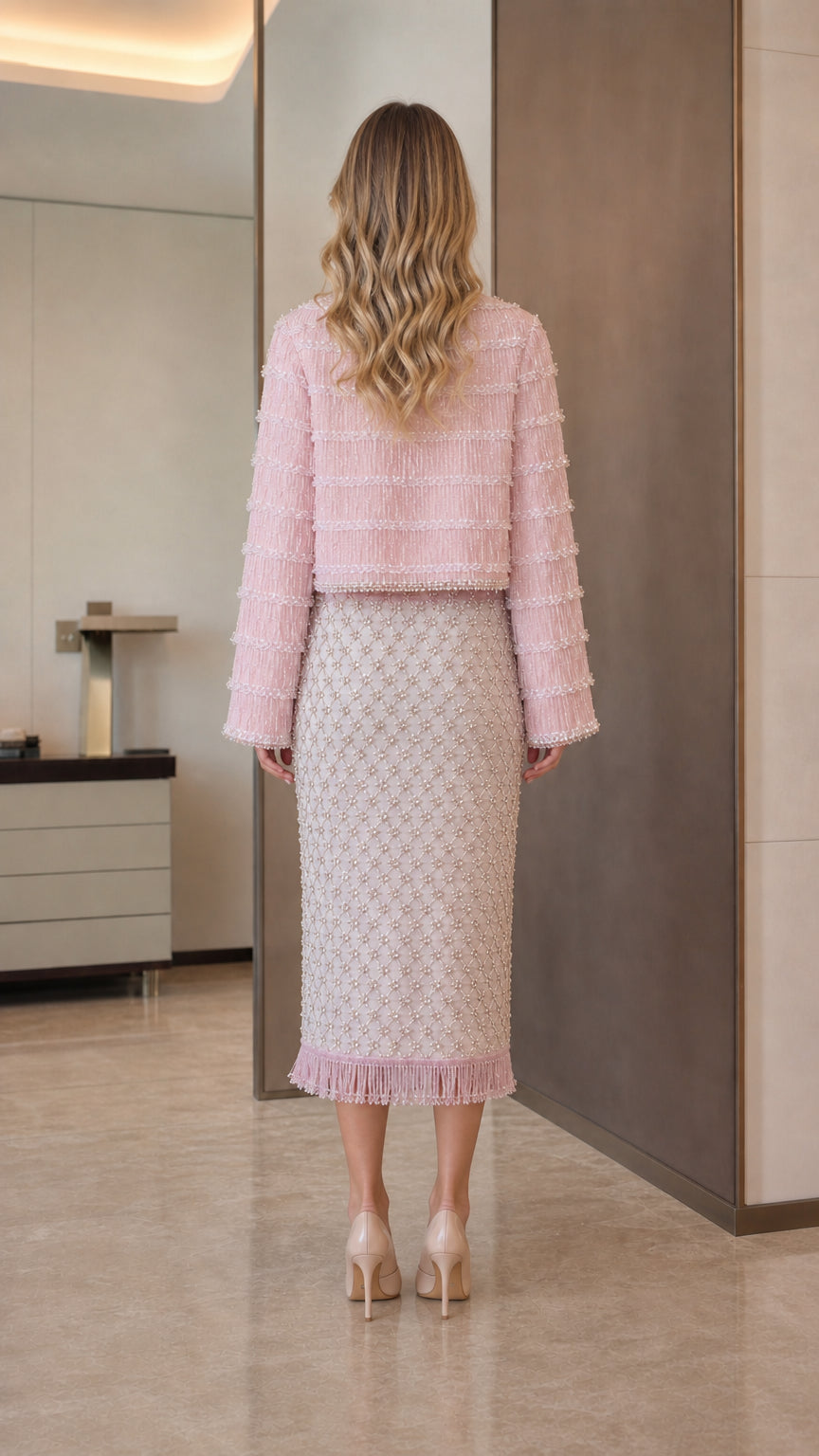 Model wearing pink tweed set back view