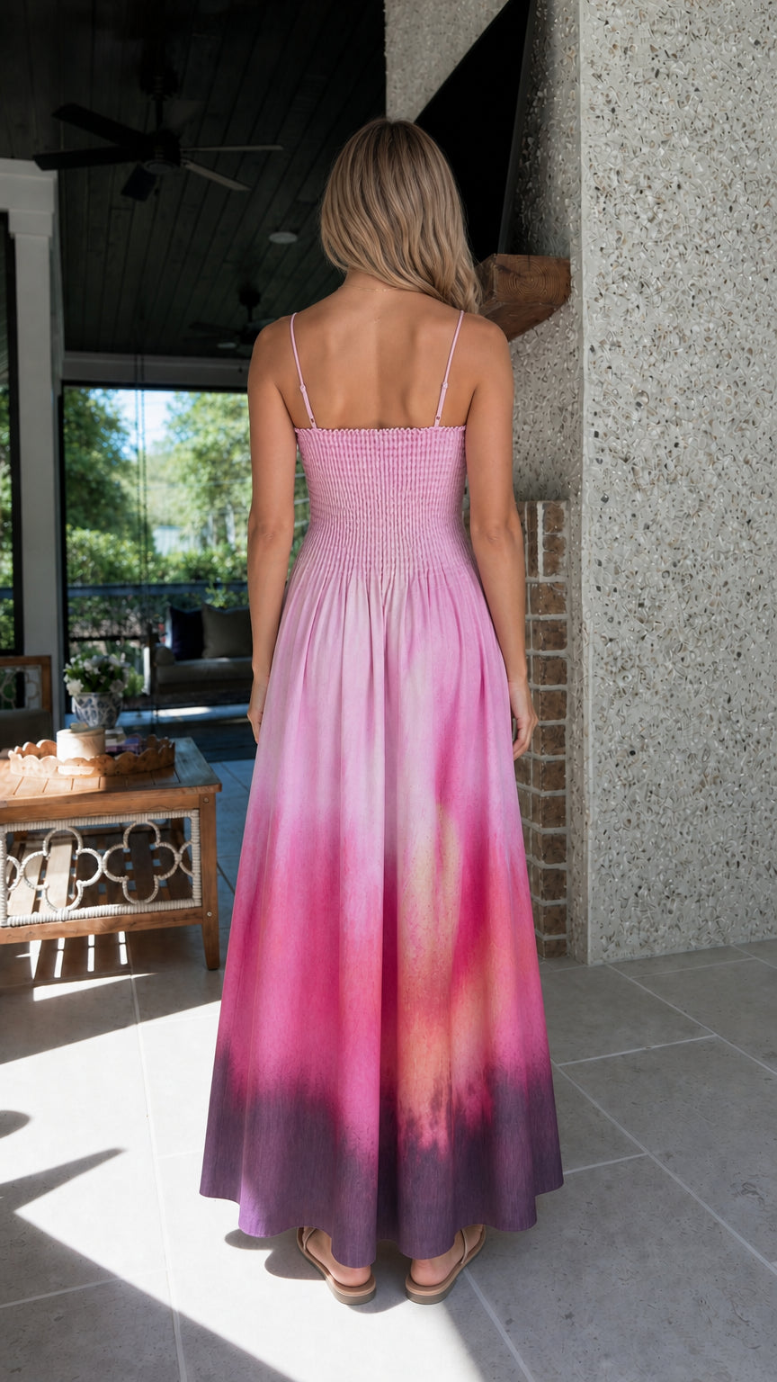 Back view of model wearing pink tie-dye maxi dress
