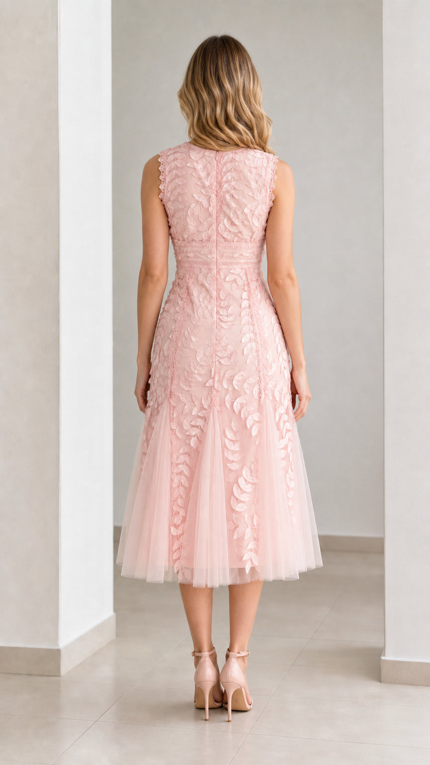 Back view of pink midi dress showing zipper and mesh flare