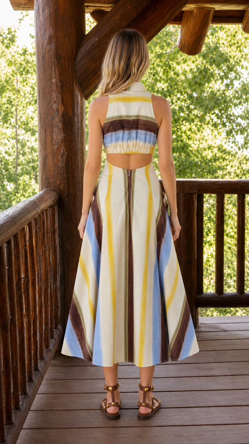 Back view of cream striped midi dress with open back detail