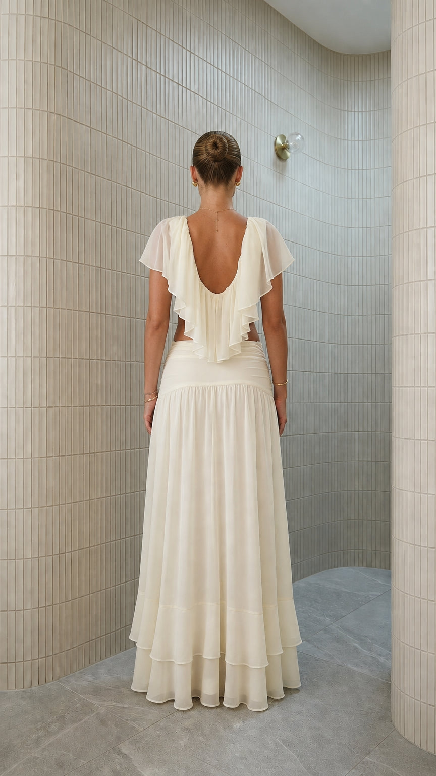 Back view of ivory two-piece set with backless ruffle detail