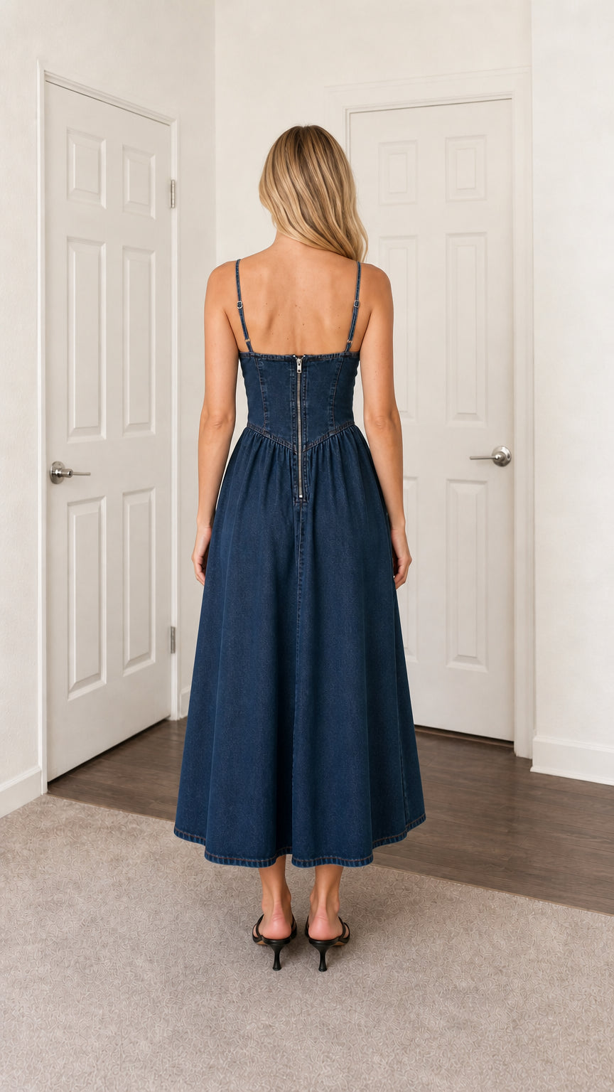 Back view of blue denim midi dress showing zipper