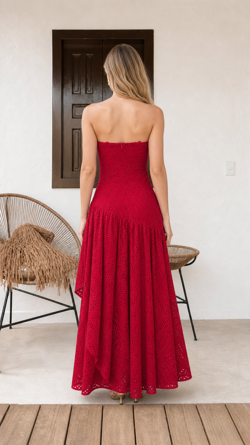 Model wearing red strapless eyelet maxi dress back view