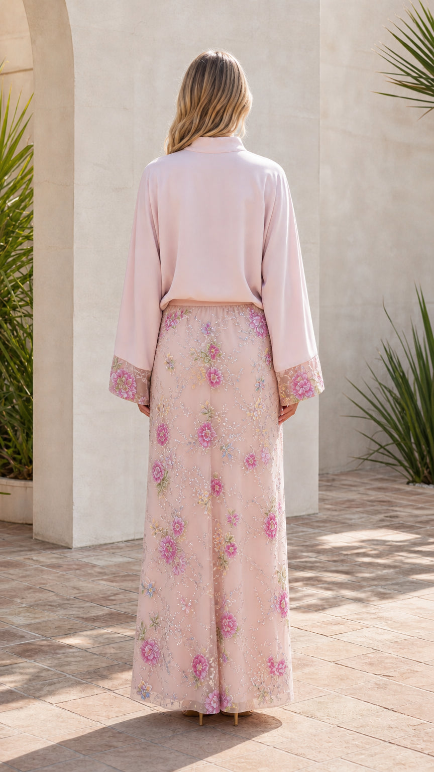 Model in pink two-piece maxi set, back view