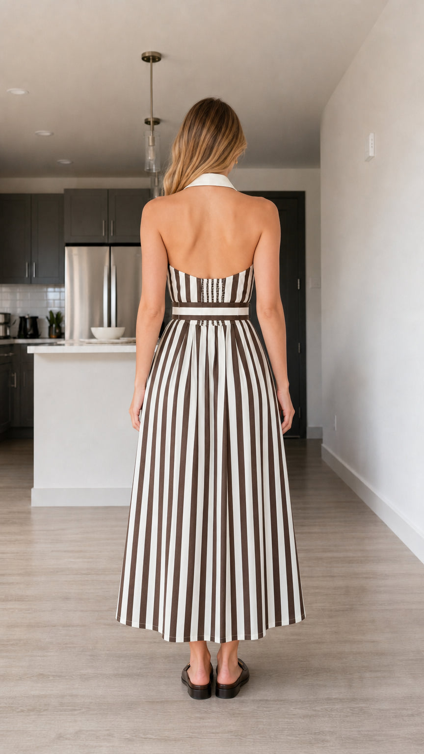 Back view of brown striped halter dress