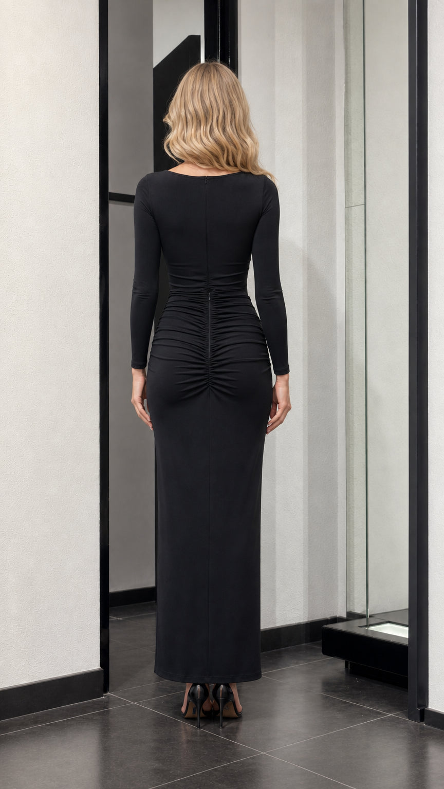 Back view of black maxi dress showing ruching detail