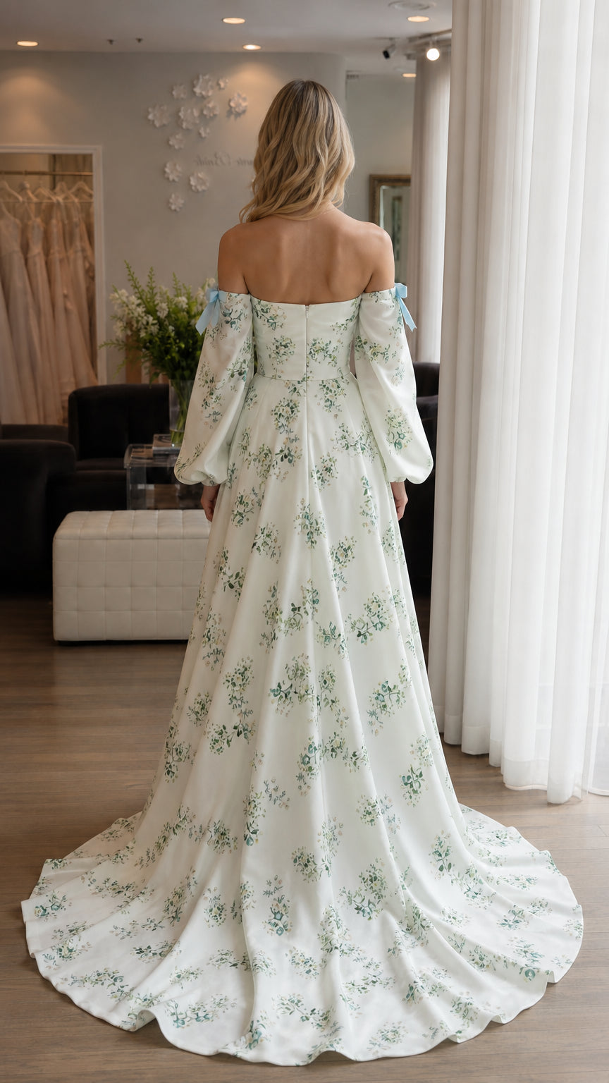 Back view of woman showing sweep train on white floral dress