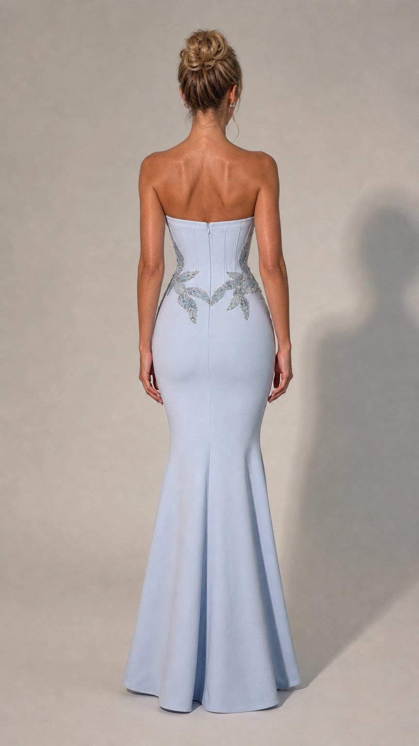 Back view of light blue strapless mermaid gown