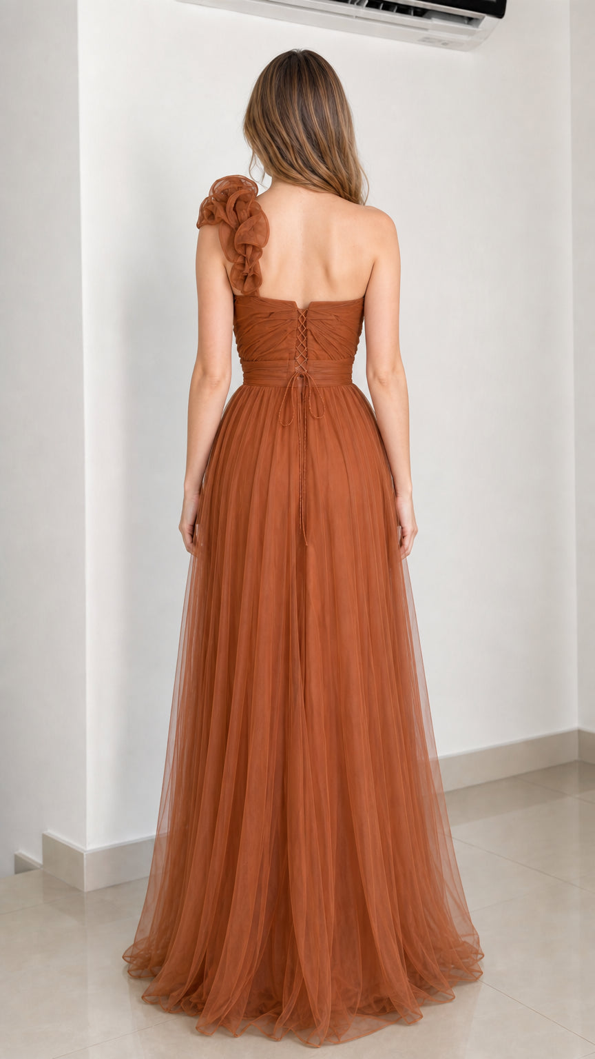 Back view of rust brown tulle evening dress showing lace-up detail