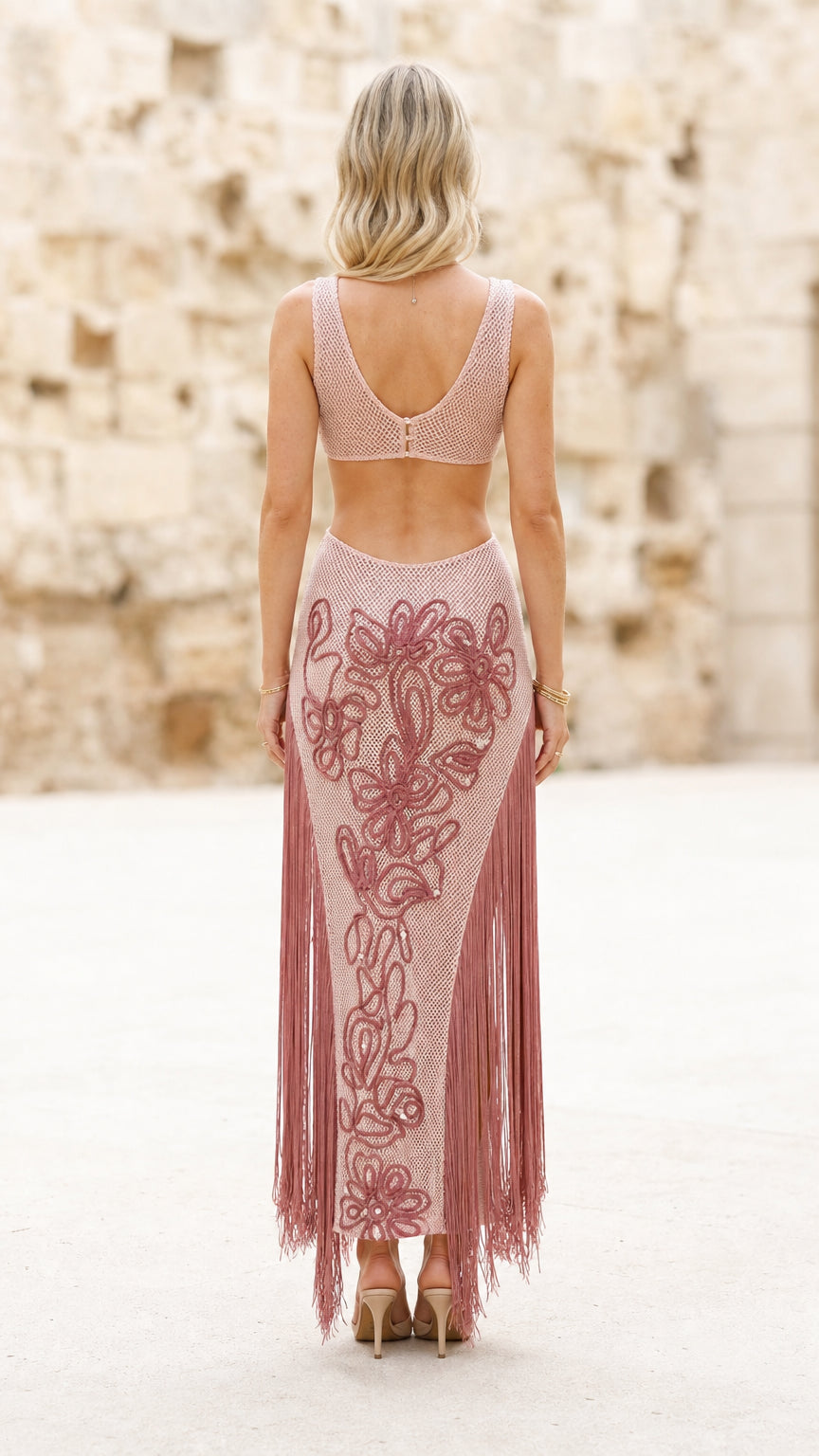 Back view of model in pink fringe dress