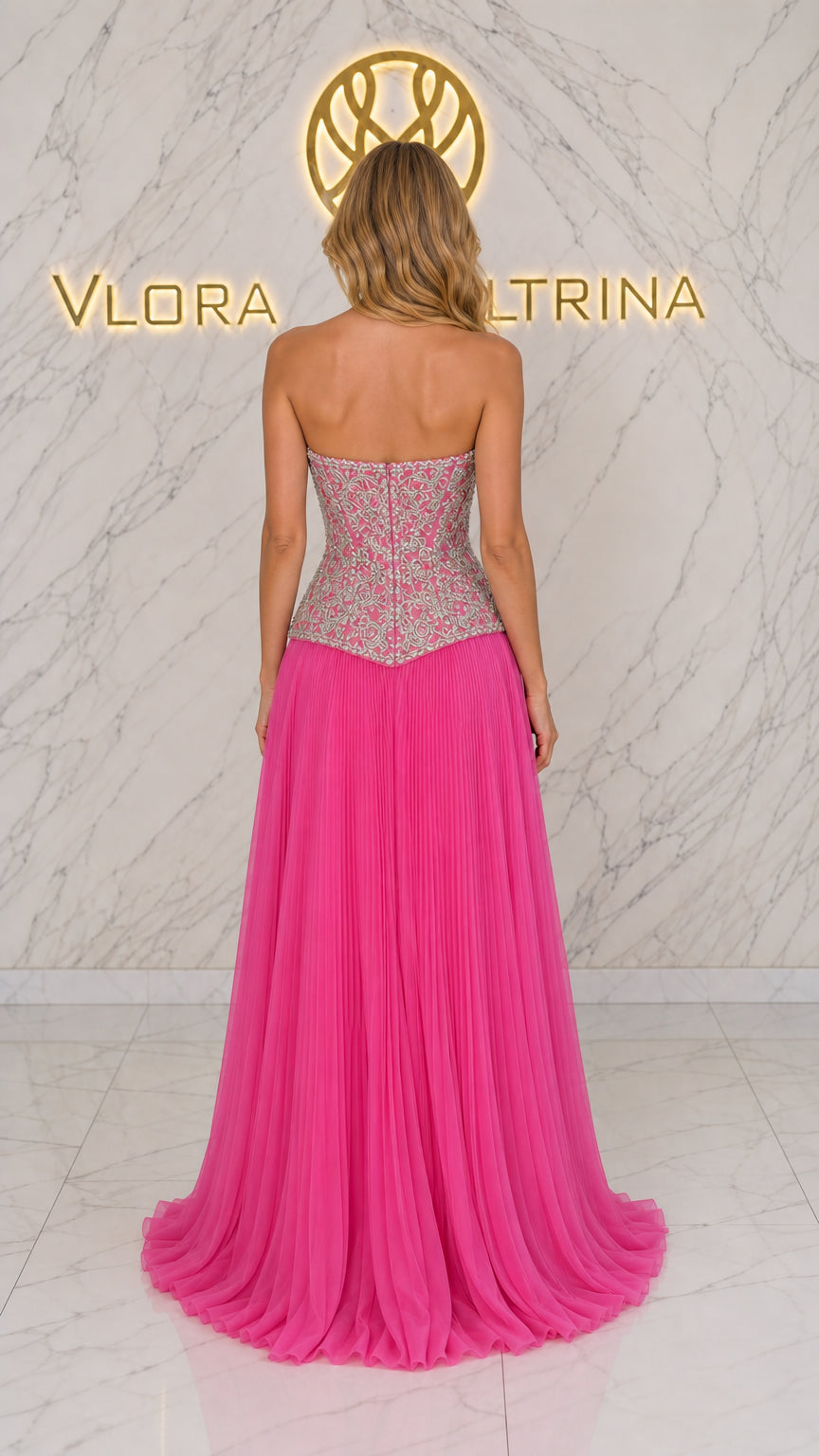 Back view of model in fuchsia strapless gown