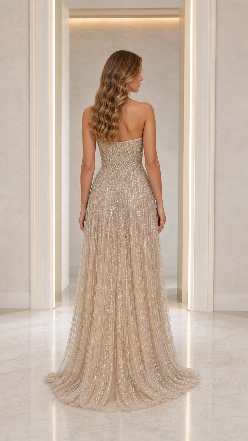 Back view showing sweeping skirt and train of Champagne gown
