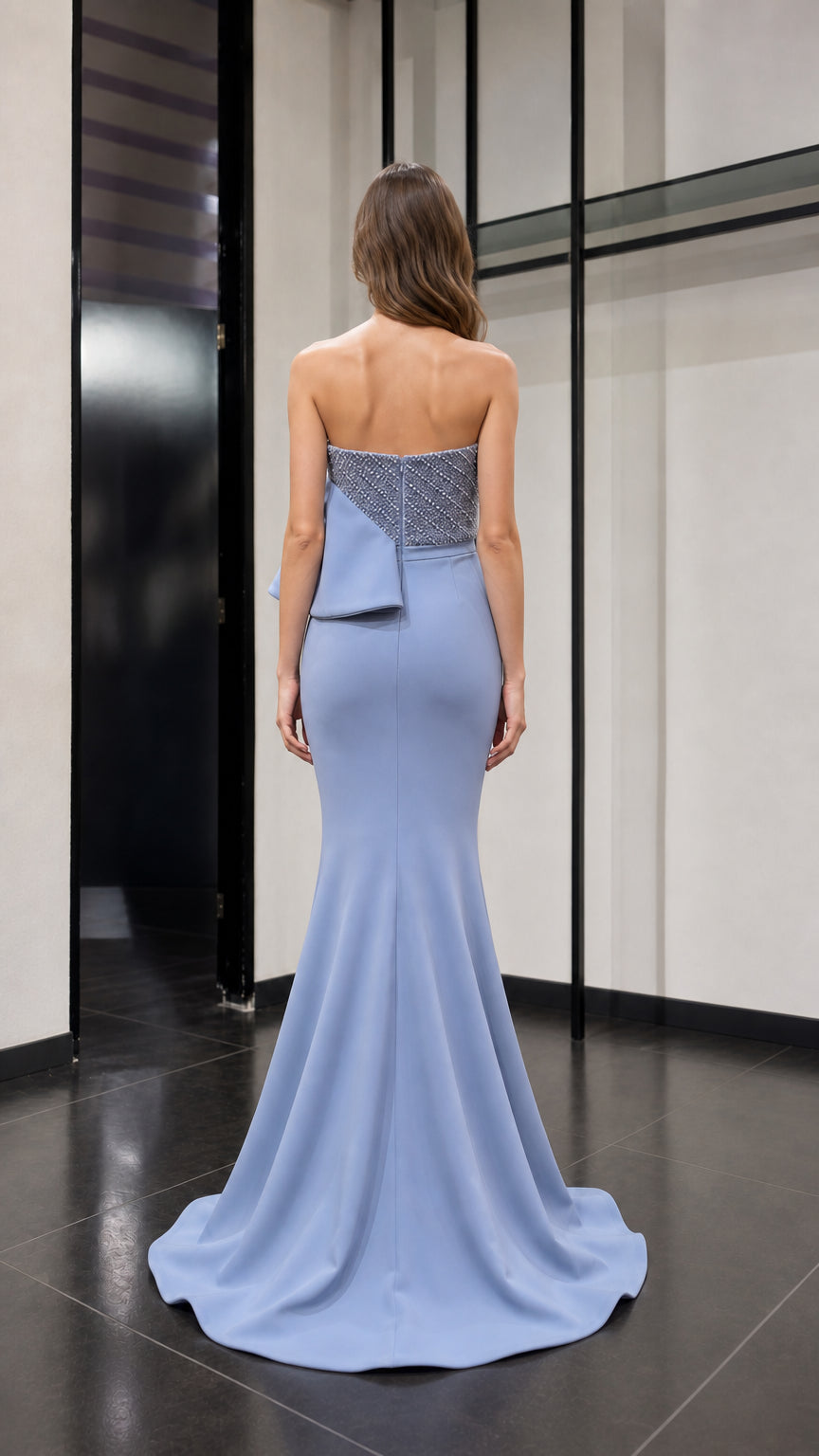 Back view of light blue formal dress showing sweep train