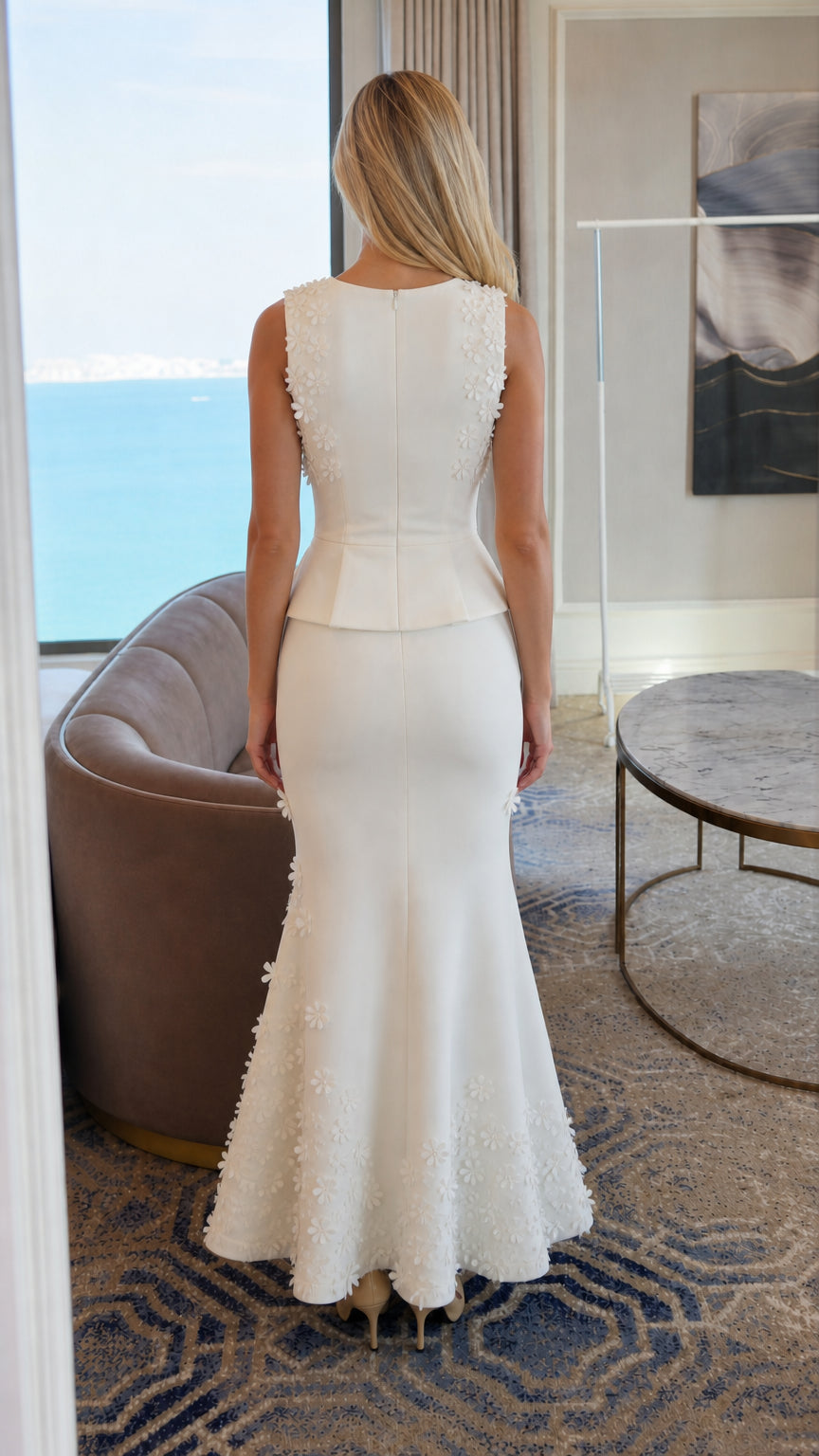 Back view of white formal peplum maxi dress