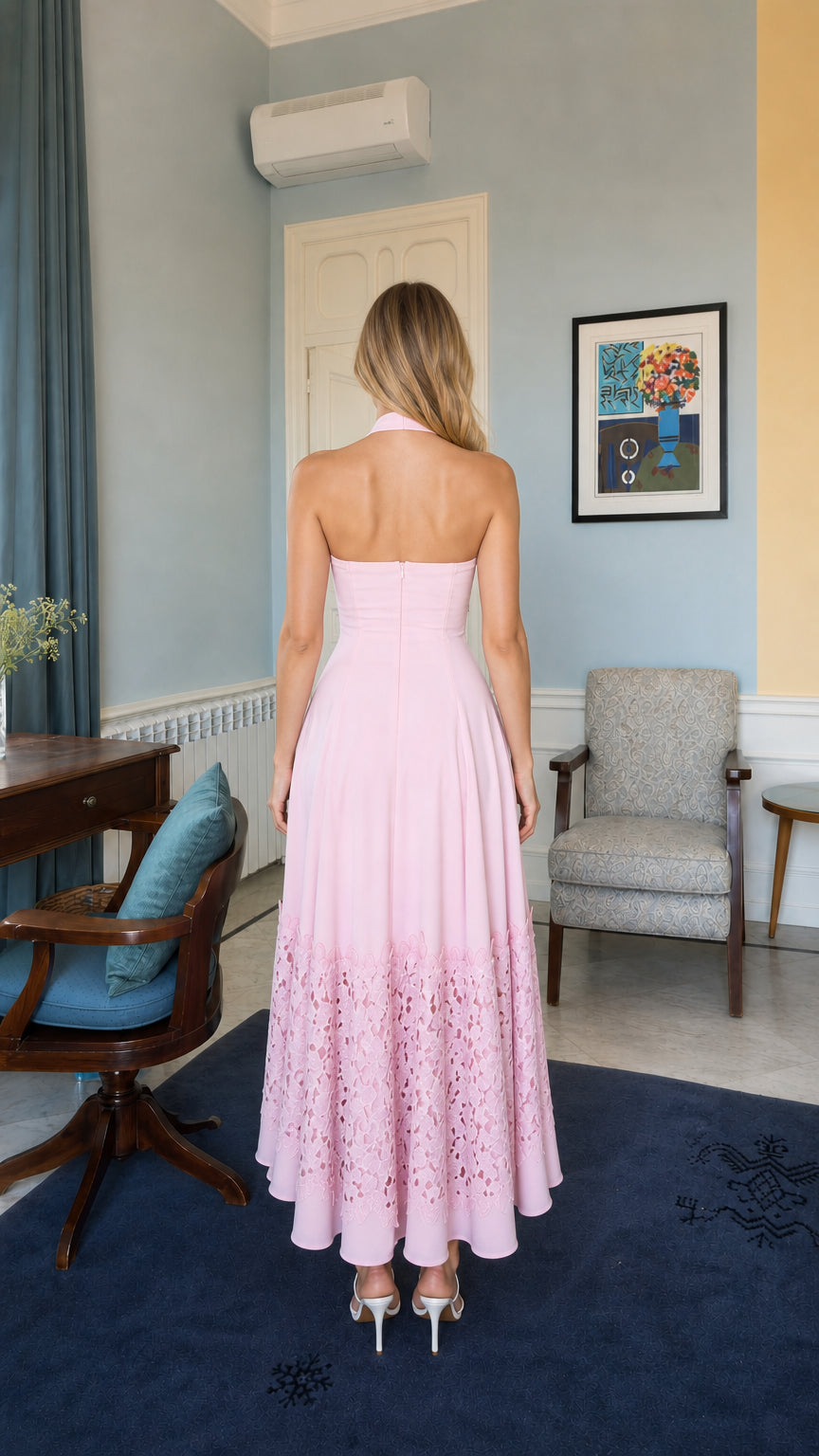 Back view of model wearing pink halter neck long dress