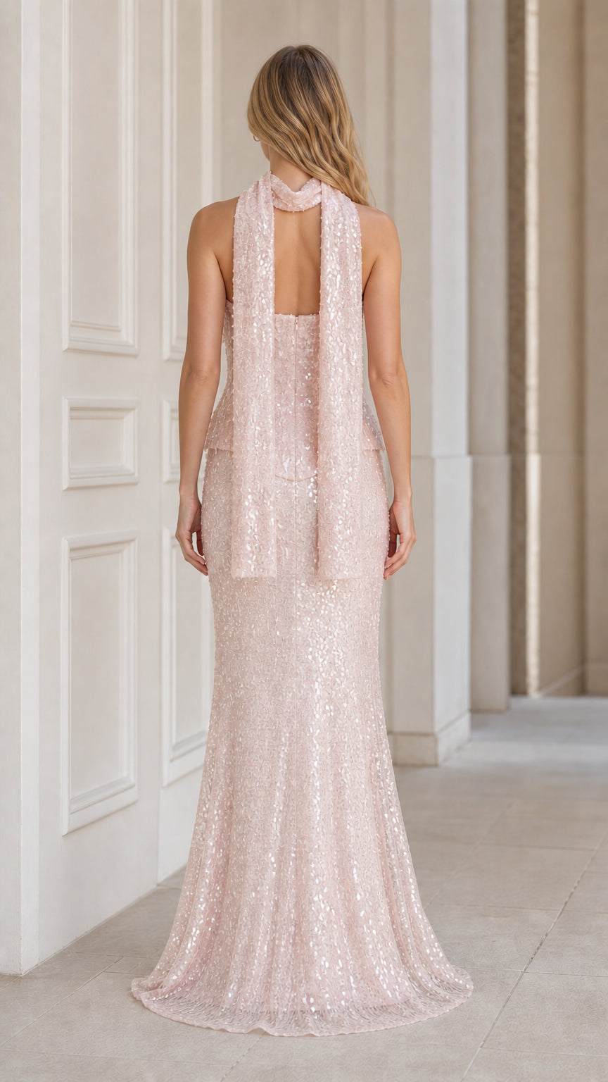 Back view of pink sequin formal dress showing scarf drape