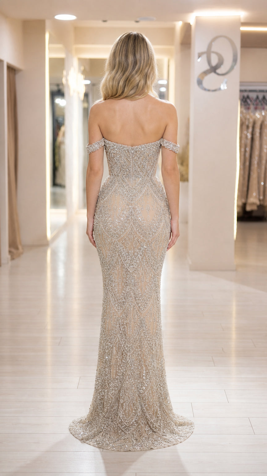 Back view of champagne formal dress showing sweep train